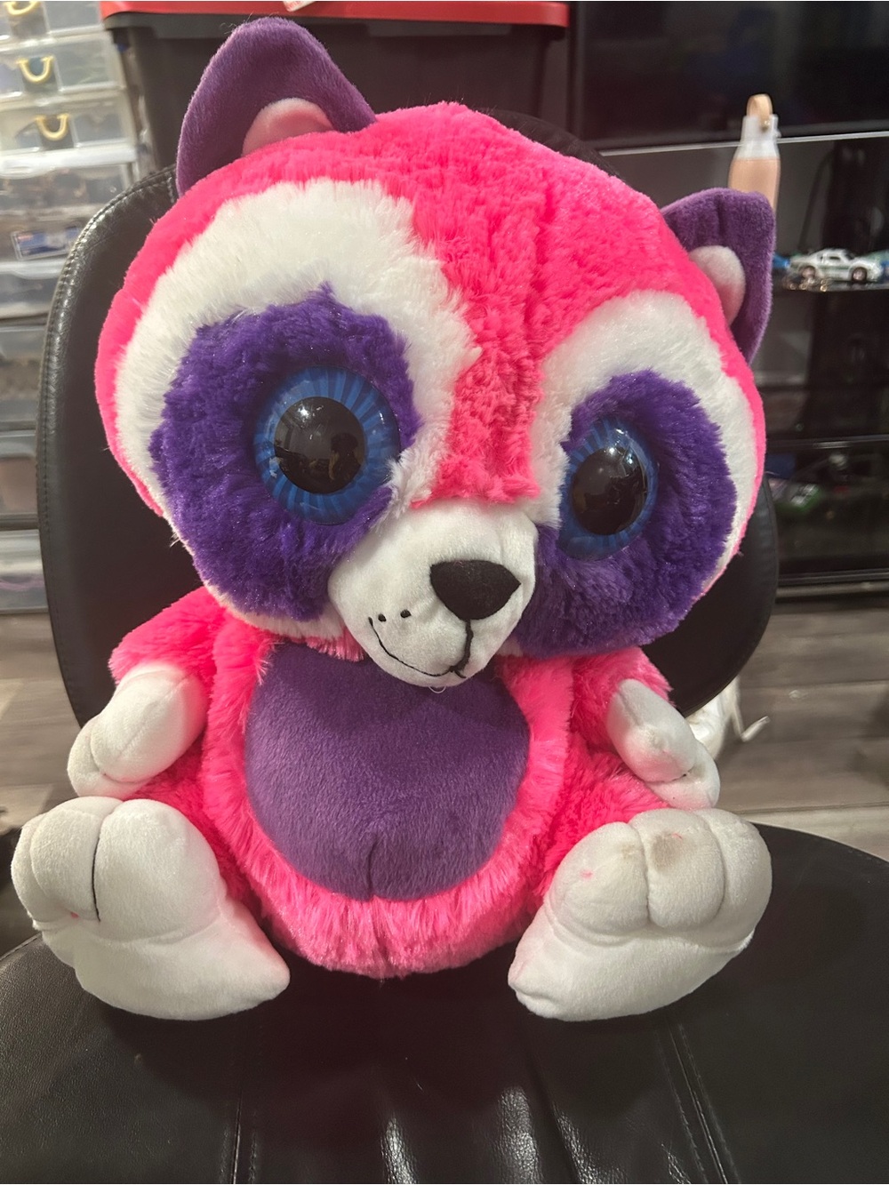 pink and purple raccoon plush toy, closely resembling the Ty Beanie Boo